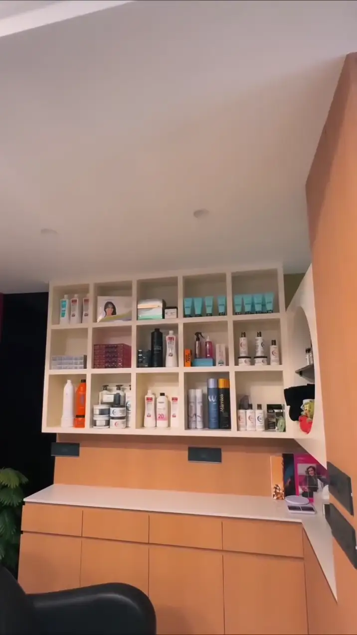 Lit shelves of hair care products