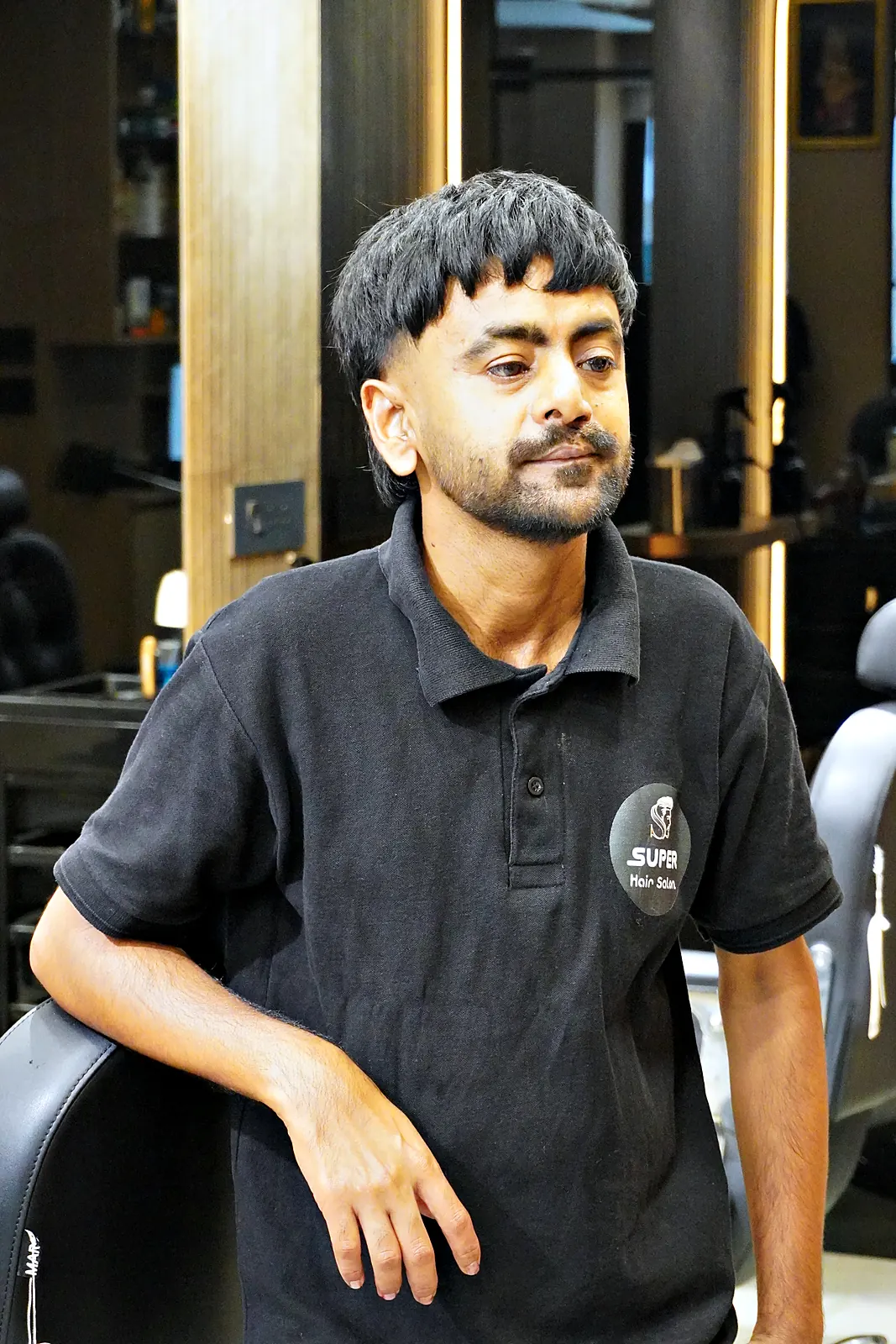 SUPER Hair Salon barber smiling in the studio