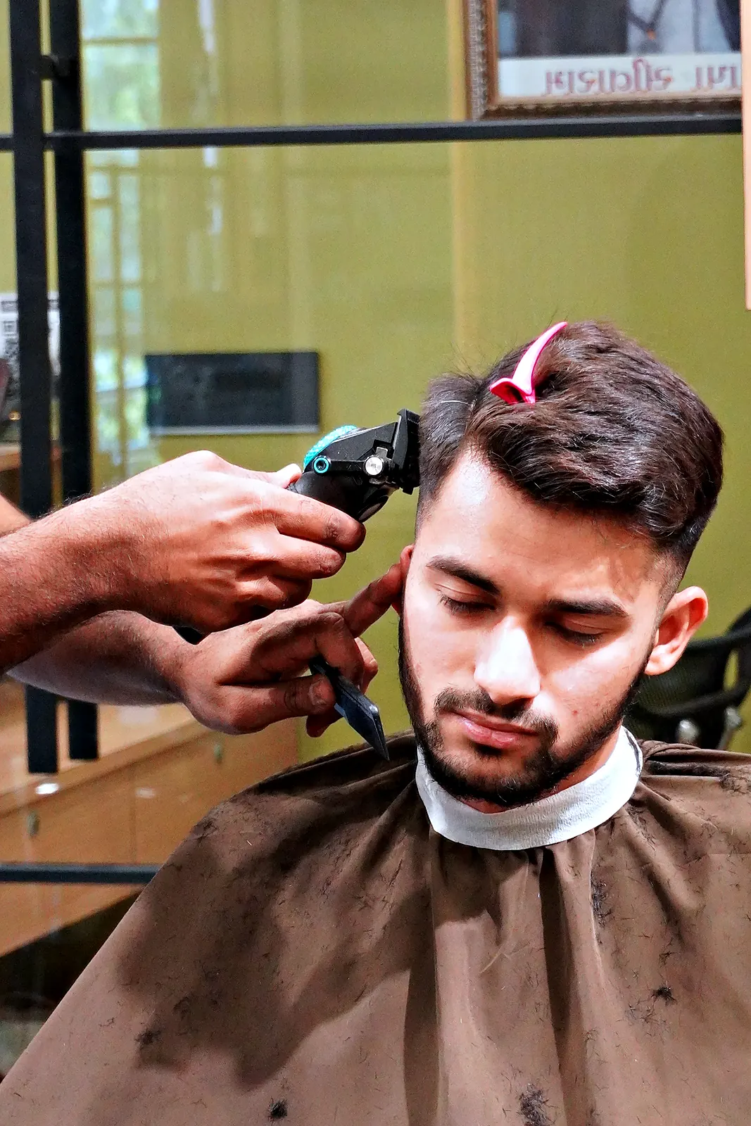Young client getting a skin fade