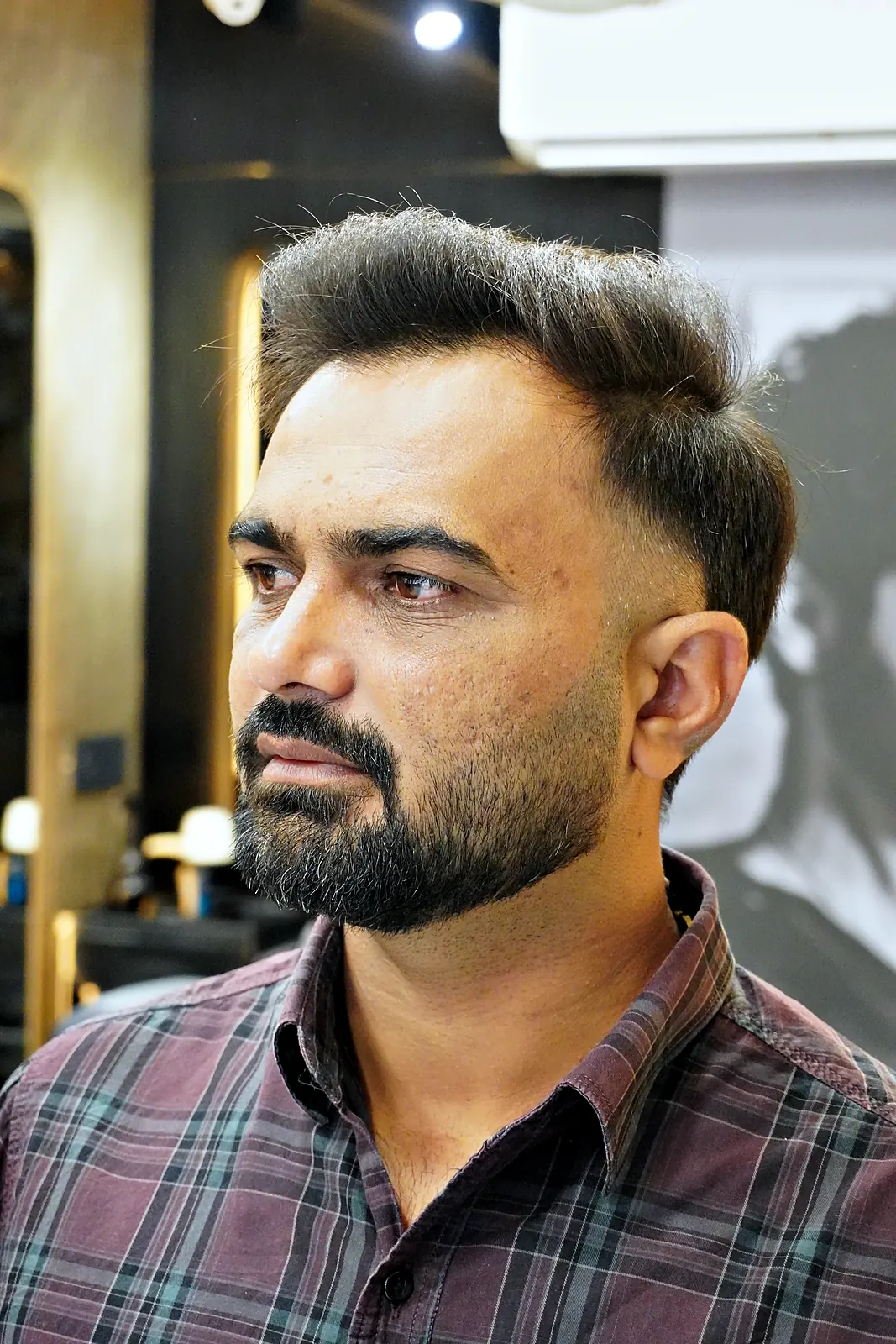 Client with a sharp textured cut and groomed beard